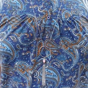 Silver necklace with a peach color stone.